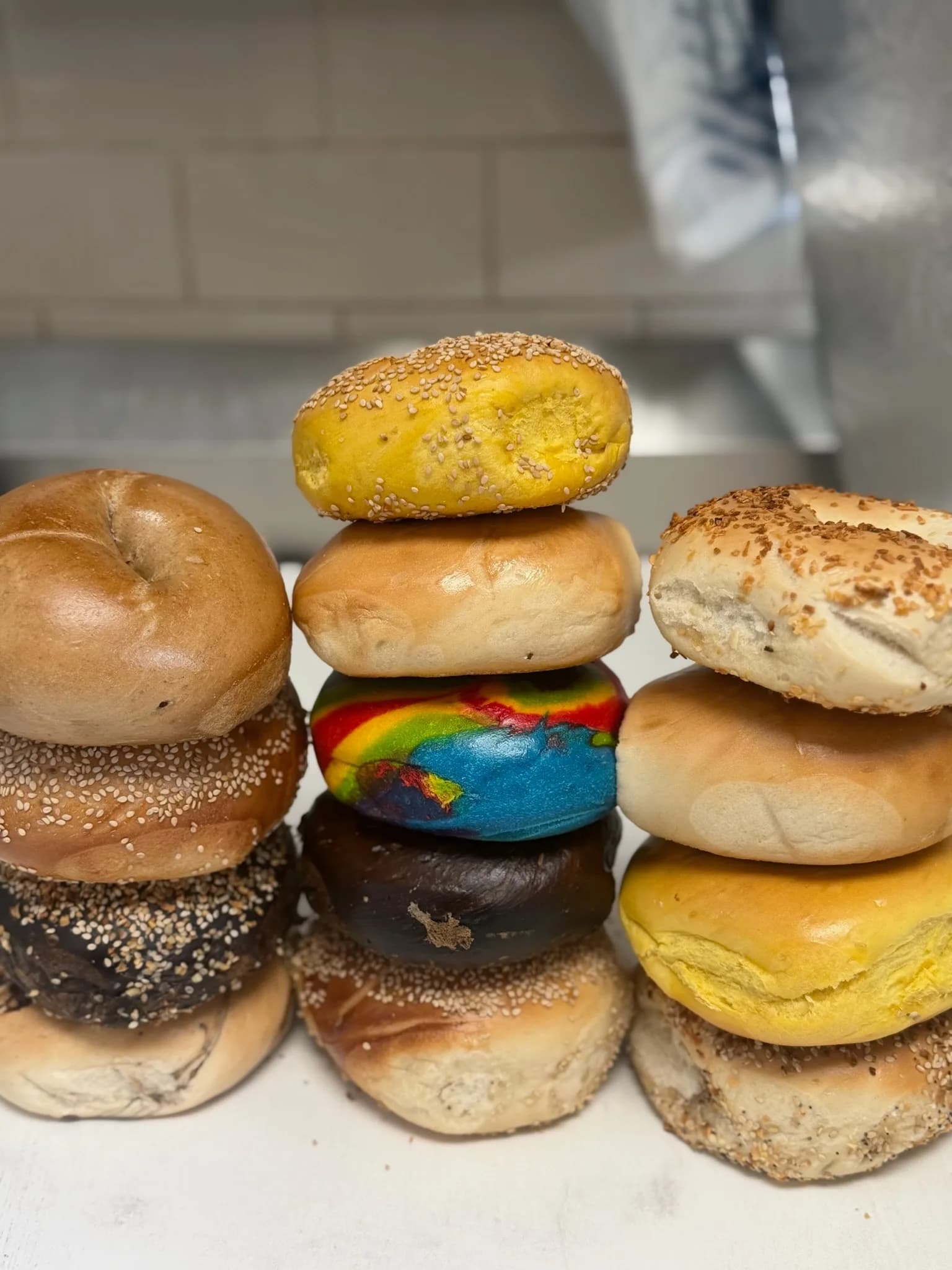 Stacked hand-rolled bagels baked in Howard Beach